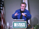 Thumbnail of USGS scientist at lecture podium