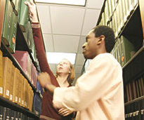 Library staff assists a student