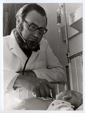 [C. Everett Koop examining an infant]. [ca. 1974].
