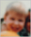 Very blurry photo of a boy illustrating vision with cataracts.