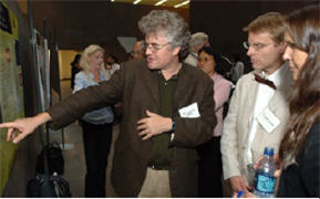 2004 Pioneer Award recipient Dr. Homme Hellinga (c) of Duke University Medical Center made a point about his work to 2005 awardees Dr. Giulio Tononi of the University of Wisconsin Medical School and Dr. Hollis T. Cline (far r) of Cold Spring Harbor Laboratory.