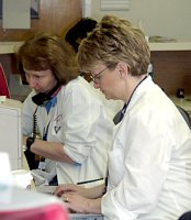Two Stem Cell Transplant Research Nurses working at a desk.