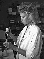 A woman performing a test in a laboratory.