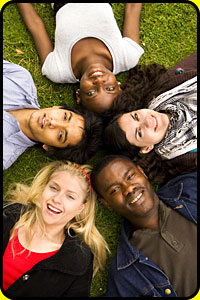 Image of a group of teenagers laying on the lawn
