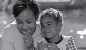 Photo of woman and child enjoying a healthy snack.