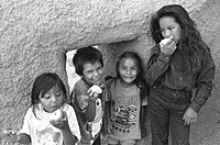 This is a picture of Pima children eating apples.