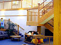 View of the Childrens Inn lobby showing the staircase and lounge area.
