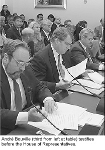 André Bouville (third from left at table) testifies before the House of Representatives