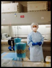 Photo of a pharmacist in a surgical gown.