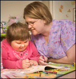 Pediatric nurse and patient in play room