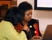 As people began to fill the Executive Conference Room in the Rall Building, Johnson-Thompson, left, queued up the PowerPoint programs with the help of Packenham, who is program director in the NIEHS Office of Scientific Director.