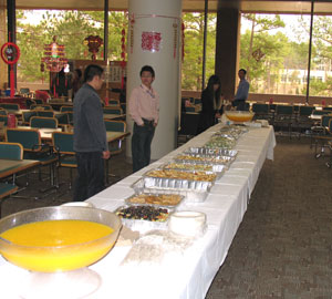 The food was plentiful at the long buffet, shown here before the performances got underway — a calm before the storm of hungry people.