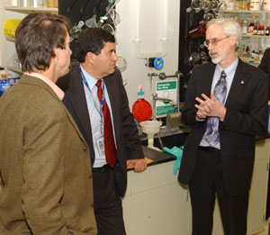 During a tour of the NCGC facility, Bucher, left, talked with Zerhouni, center, and Austin.