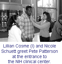 Photo: Lillian Cosme and Nicole Schuett greet Pete Patterson at the entrance to the NIH clinical center.