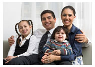 Photo of a Hispanic family—a father, mother, and two young children
