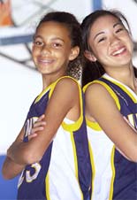 Photograph of two adolesscent girl basketball players