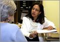 Genetic counselor talking with a patient