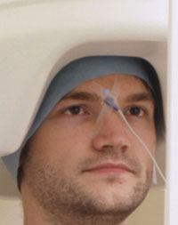 MEG scanner being used on a man