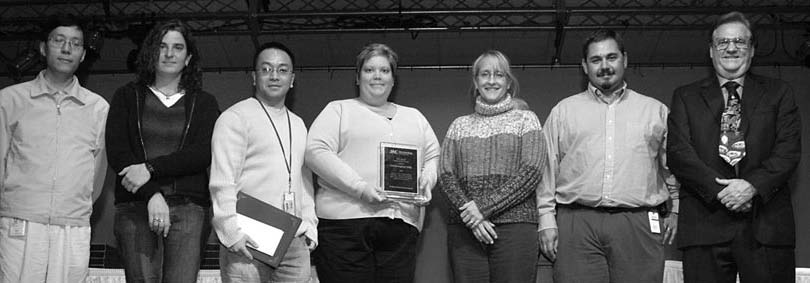 CORE GENOTYPING FACILITY TEAM WINS AWARD: Zhaoming Wang, Meredith Yeager, Xiang Deng, Amy Hutchinson, Marianne Rivera-Silva, and Robert Welch with SAIC-Frederick President Larry Arthur.