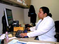 Maritza completes a lot of tasks at her desk, including monthly statistics and tracking patient records.