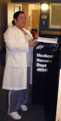 Maritza spends many afternoons retrieving records from various NIH clinics and returning them to the Medical Records department for re-filing.