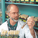 Clipart: Photo of scientist with specimens.