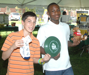 Frisbee competition winners Matthew Fall and Jae Lee under the Earth Day tent.