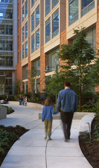 A patient walking through the courtyard at the NIH Clinical Center.