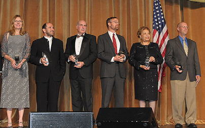 Winning team members at the award presentation include (from l) Dr. Patricia Mabry, Dr. Bobby Milstein, Dr. Gary Hirsch, Andrew Jones, Dr. Joyce Essien and Kevin Klein. (Not shown are Jack Homer, Dr. Diane Orenstein and Kristina Wile.)