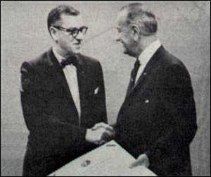 Photograph of Dr. James A. Shannon, NIH Director, 1955 - 1968, receiving the Distinguished Federal Civilian Service Award from President Lyndon B. Johnson in 1966.