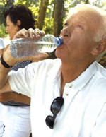 Photo of a man drinking water