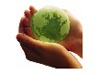 Picture of hands holding a green Earth
