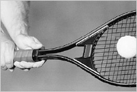 Tennis tacket hitting tennis ball