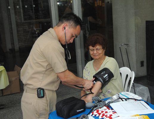 Blood pressure screening offers a chance to meet corps members.