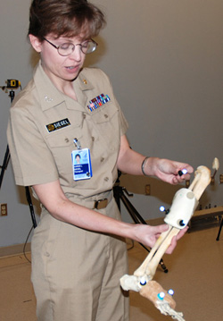 Physical therapist Karen Siegel shows lab components.