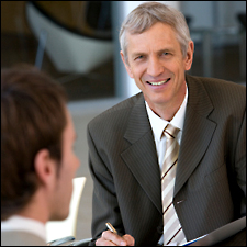 Two men in suits talking