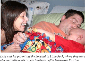 Lake and his parents at the hospital in Little Rock, where they were able to continue his cancer treatment after Hurricane Katrina