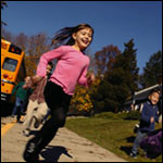 Photo: A girl getting off of a school bus