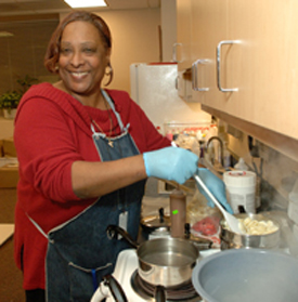 CC staff member melts chocolate for molding.