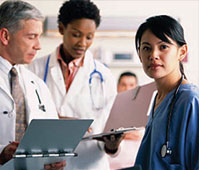 Caucasian male doctor, Black female doctor, and Asian nurse: Doctors consult with each other on medical charts, while nearby nurse holds x-ray and faces reader.