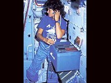 Astronaut Sally Ride floats around inside the space shuttle