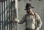 Dave Hiller holds bridle of his own design, Little Owyhee Line Camp