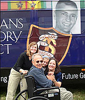 The Thomas Family in front of the bus
