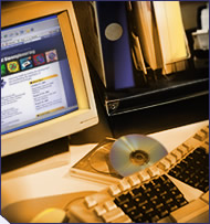 Research materials next to a computer.