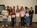 Interns holding certificates after awards ceremony