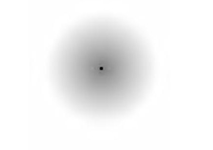 black dot surrounded by gray haze