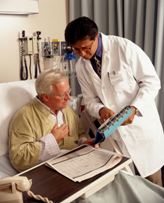 Doctor and patient look at medical papers