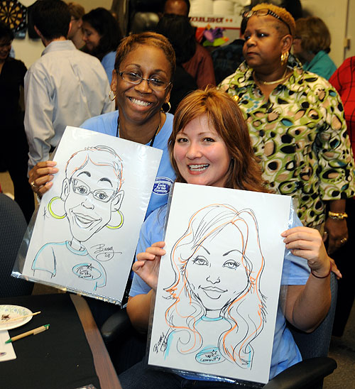 CFC volunteers show off their caricatures