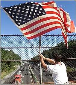 Flag being proudly waved for travelers on a U.S. Interstate highway in Baltimore