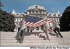 Flag being carried by proud Americans